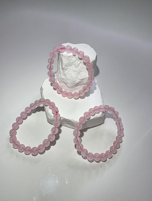 Rosenquarz Armband mittel - natürliche rosa Kristallperlen handgefädelt

